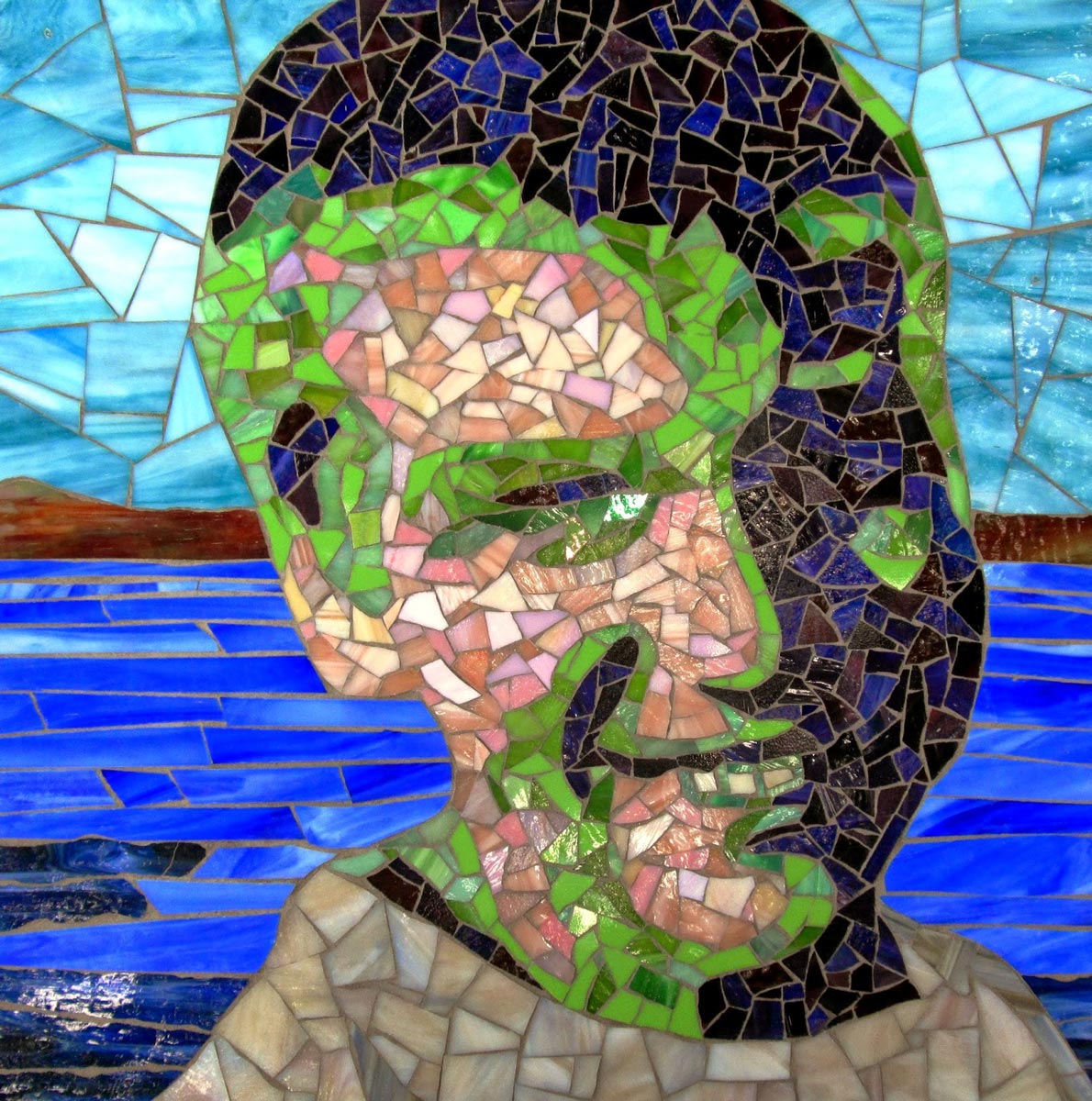 Happy Austin glass mosaic portrait by Jeannette Brossart, Durham NC
