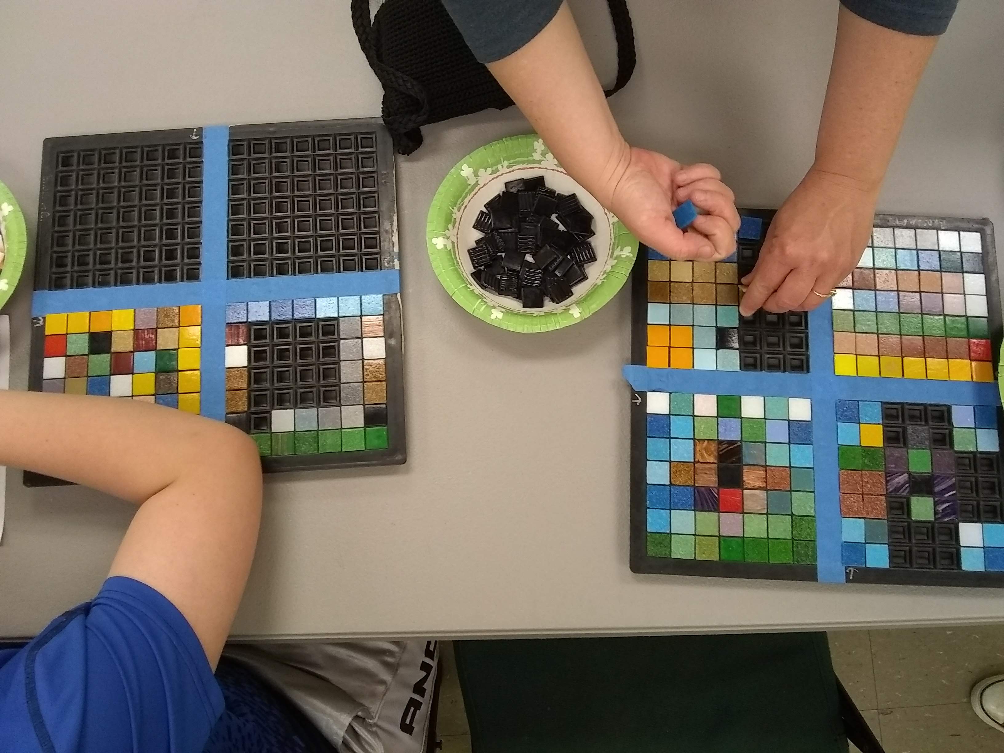 students exploring math and mosaics, with teaching artist, Jeannette Brossart, NC